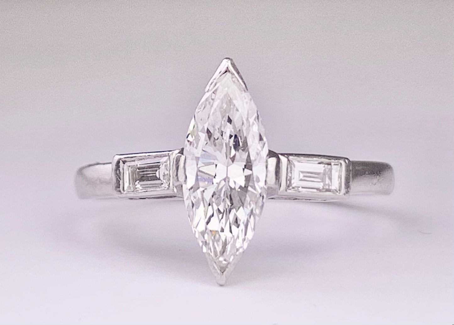 (Circa 1950s) Ring Platinum | Marquise G VS Clarity Dia .75 carats SD .12ct