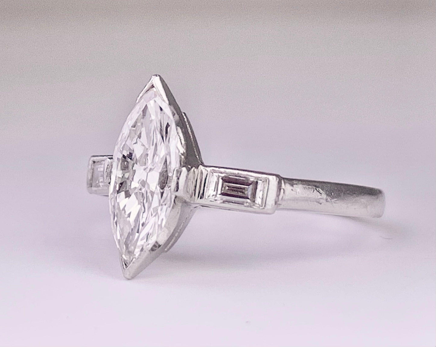 (Circa 1950s) Ring Platinum | Marquise G VS Clarity Dia .75 carats SD .12ct