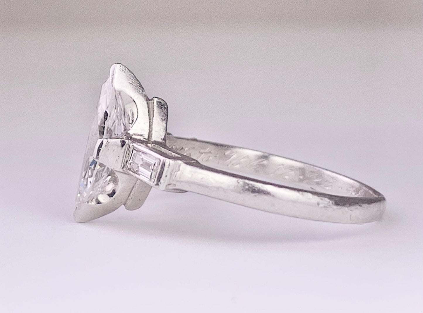 (Circa 1950s) Ring Platinum | Marquise G VS Clarity Dia .75 carats SD .12ct
