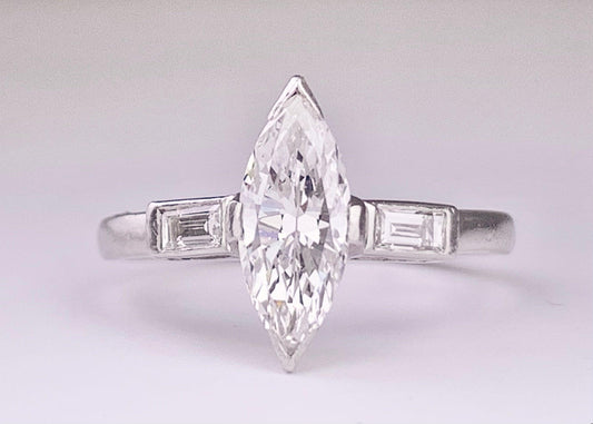 (Circa 1950s) Ring  Platinum | Marquise G VS Clarity Dia .75 carats SD .12ct