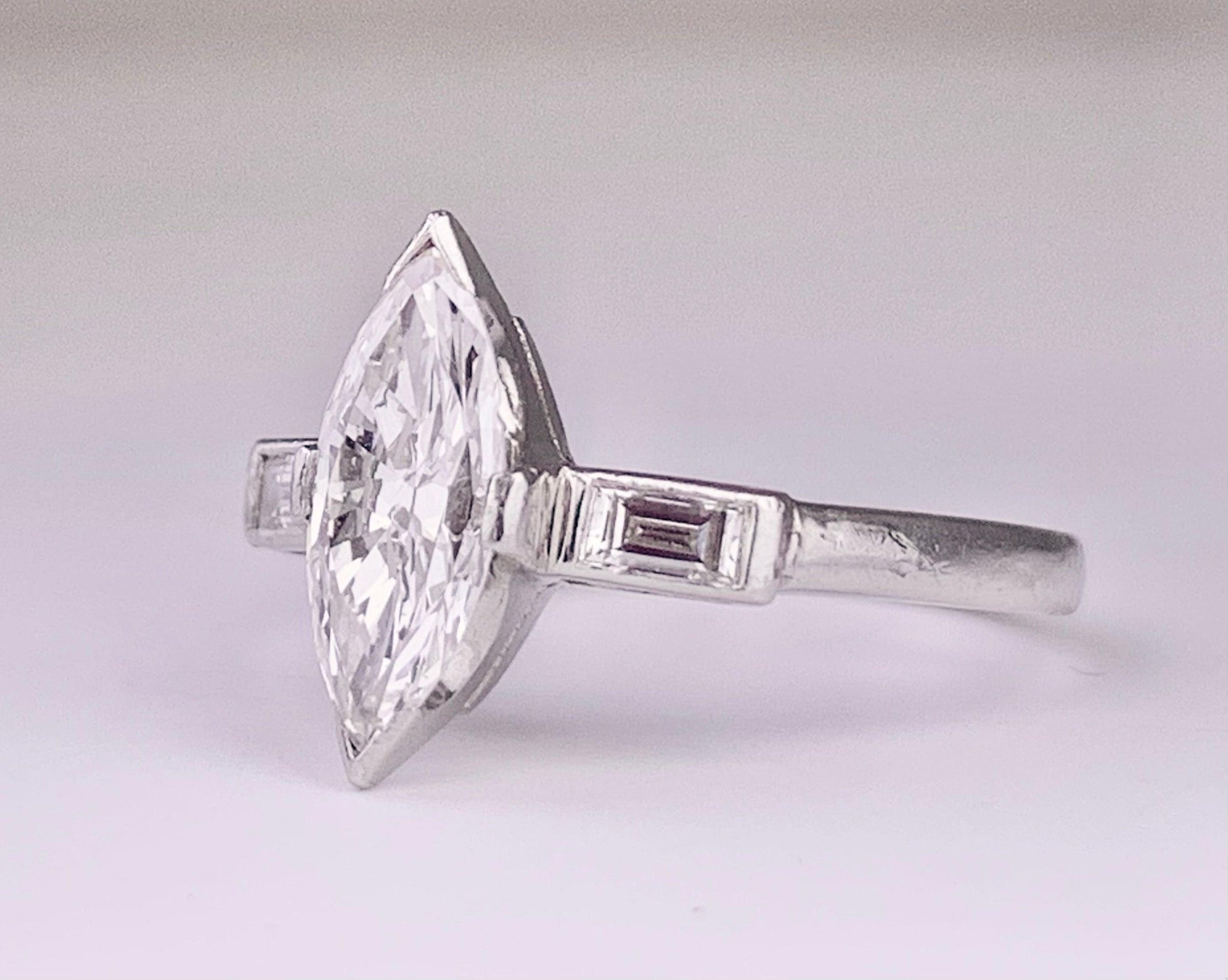 (Circa 1950s) Ring  Platinum | Marquise G VS Clarity Dia .75 carats SD .12ct