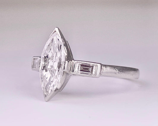 (Circa 1950s) Ring  Platinum | Marquise G VS Clarity Dia .75 carats SD .12ct