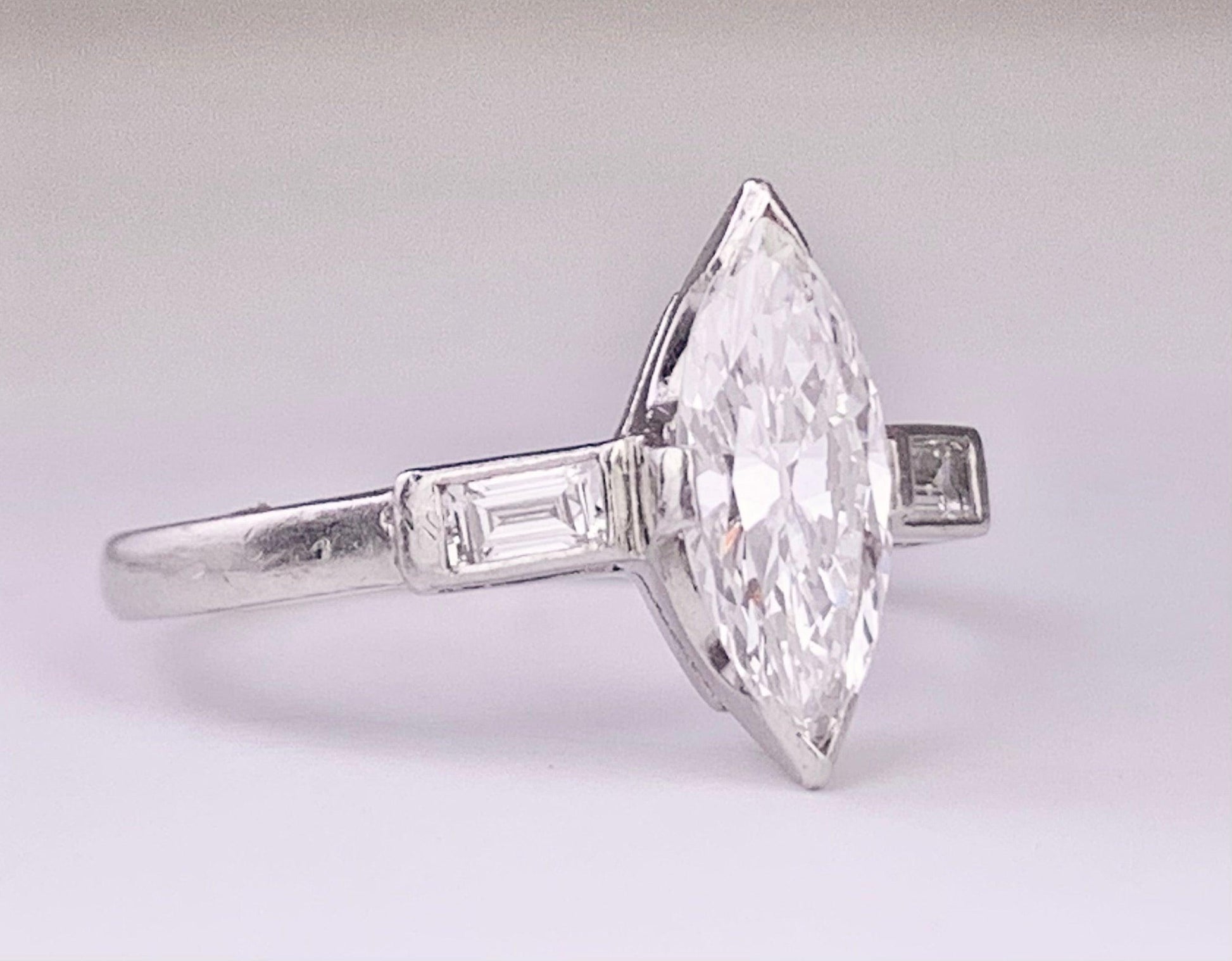 (Circa 1950s) Ring  Platinum | Marquise G VS Clarity Dia .75 carats SD .12ct