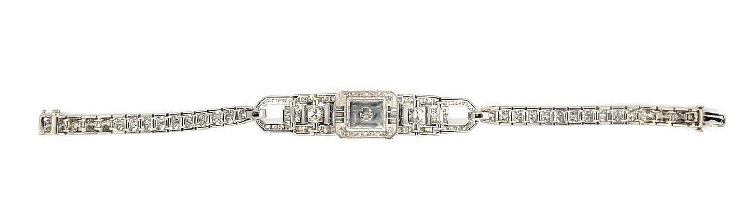 Art Deco .64ct Center Diamond Platinum Vintage Bracelet (Circa 1930s) .42ct (Six Baguette Diamonds) 3ct (104 Side Diamonds)