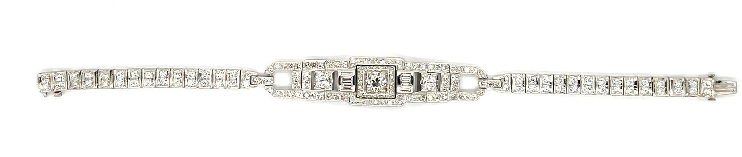 Art Deco .64ct Center Diamond Platinum Vintage Bracelet (Circa 1930s) .42ct (Six Baguette Diamonds) 3ct (104 Side Diamonds)