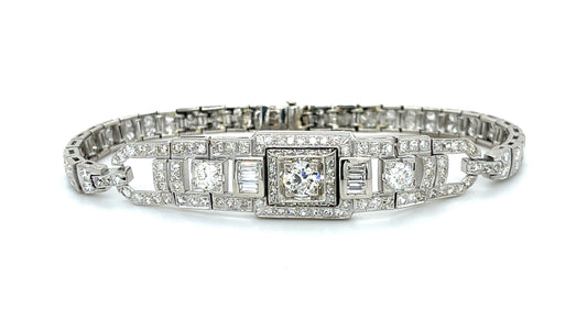 Art Deco .64ct Center Diamond Platinum Vintage Bracelet (Circa 1930s) .42ct (Six Baguette Diamonds) 3ct (104 Side Diamonds)