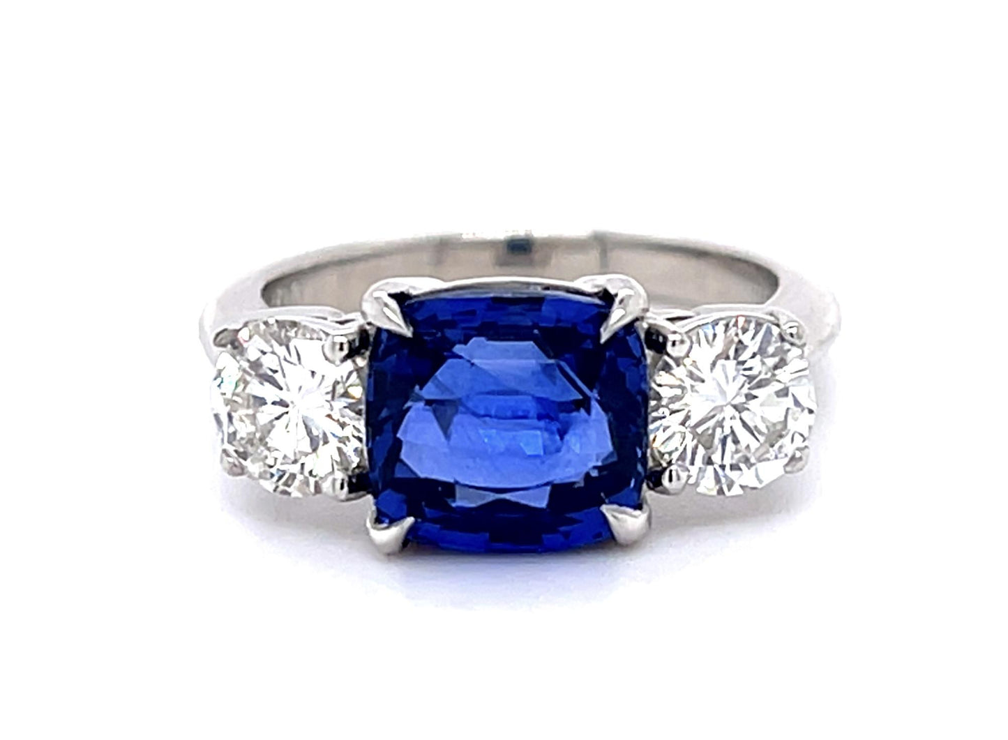 4.05ct Cushion Heated Sapphire Platinum Three Stone Ring