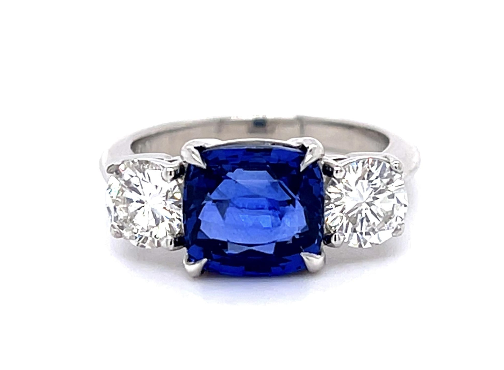 4.05ct Cushion Heated Sapphire Platinum Three Stone Ring