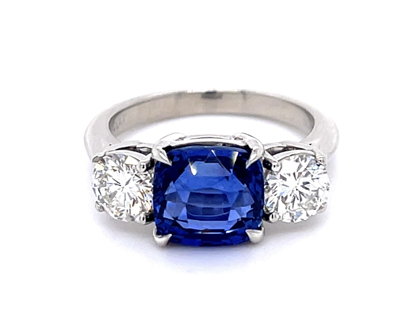 4.05ct Cushion Heated Sapphire Platinum Three Stone Ring