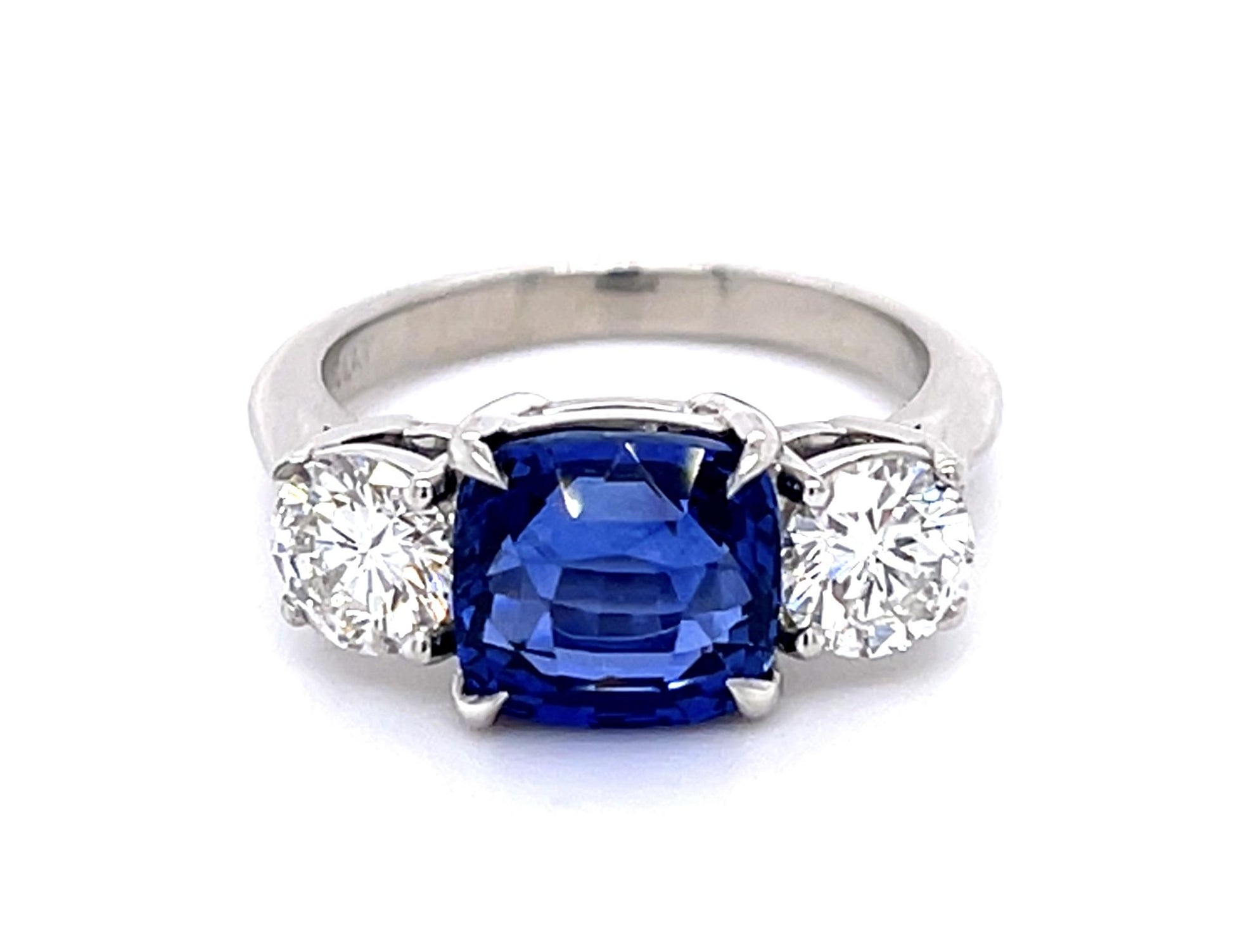4.05ct Cushion Heated Sapphire Platinum Three Stone Ring