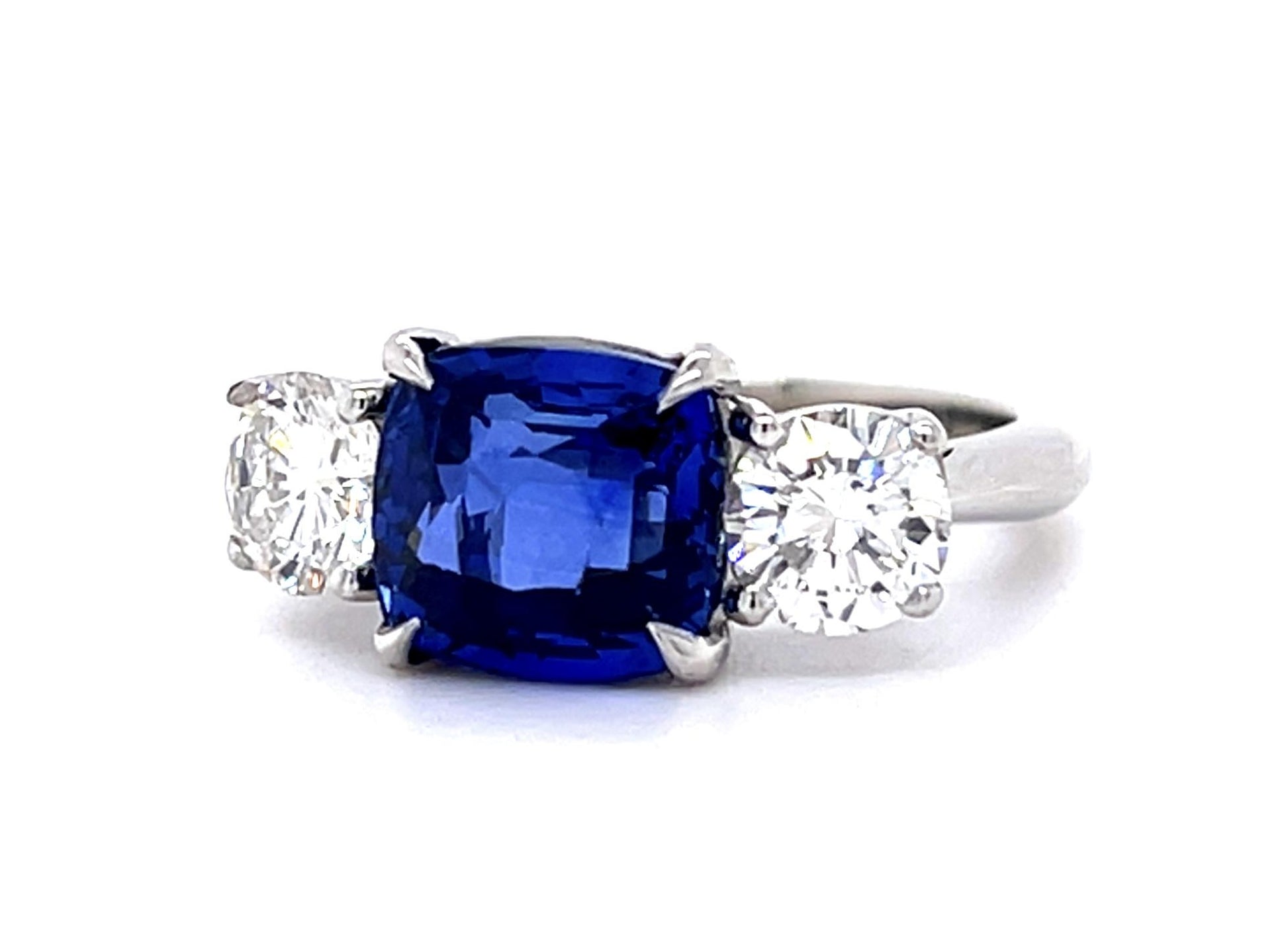 4.05ct Cushion Heated Sapphire Platinum Three Stone Ring