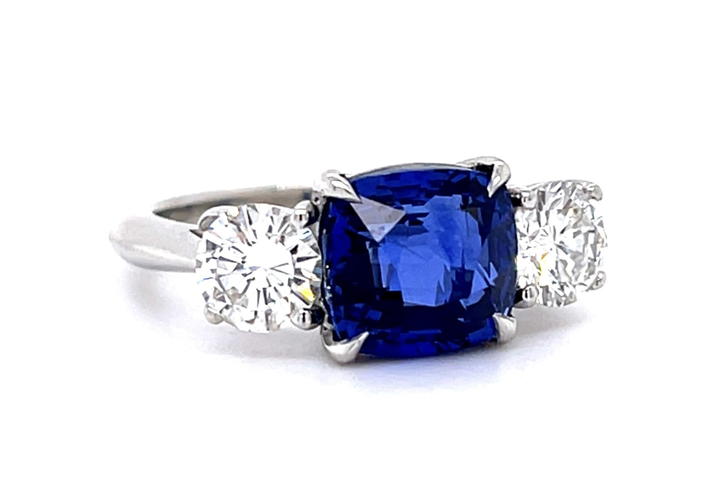 4.05ct Cushion Heated Sapphire Platinum Three Stone Ring
