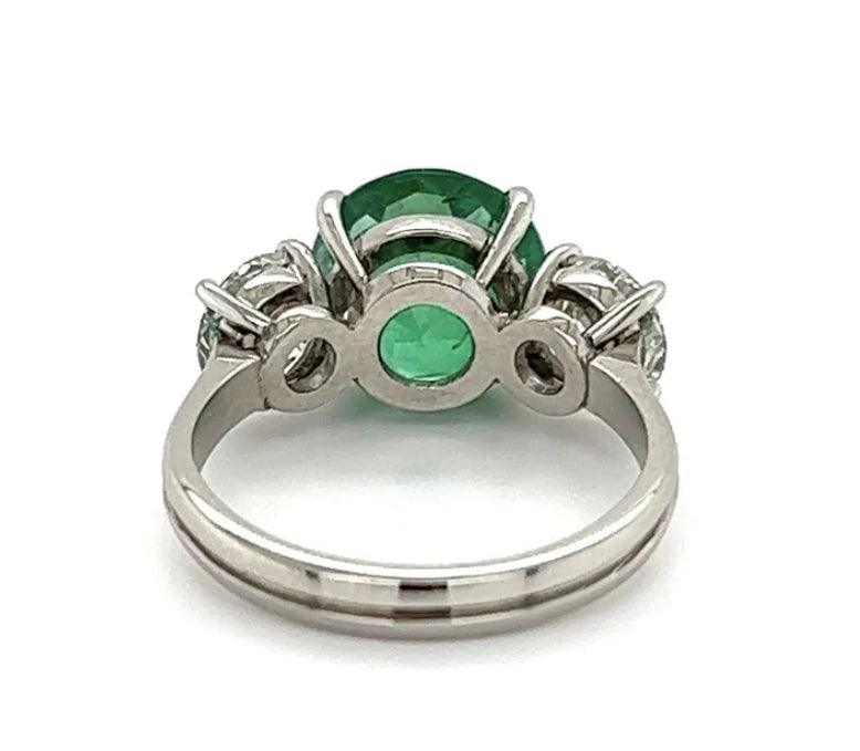 3.20ct GIA Zambian F2 Emerald .91ct GIA I SI1 Diamond .94ct GIA I SI1 Diamond Platinum Three Stone Ring