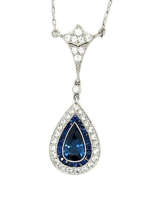 1.49ct Pear Sapphire .74ct Diamonds .69ct Calibre Side Sapphires Platinum Pendant 6.20gr Length 18"